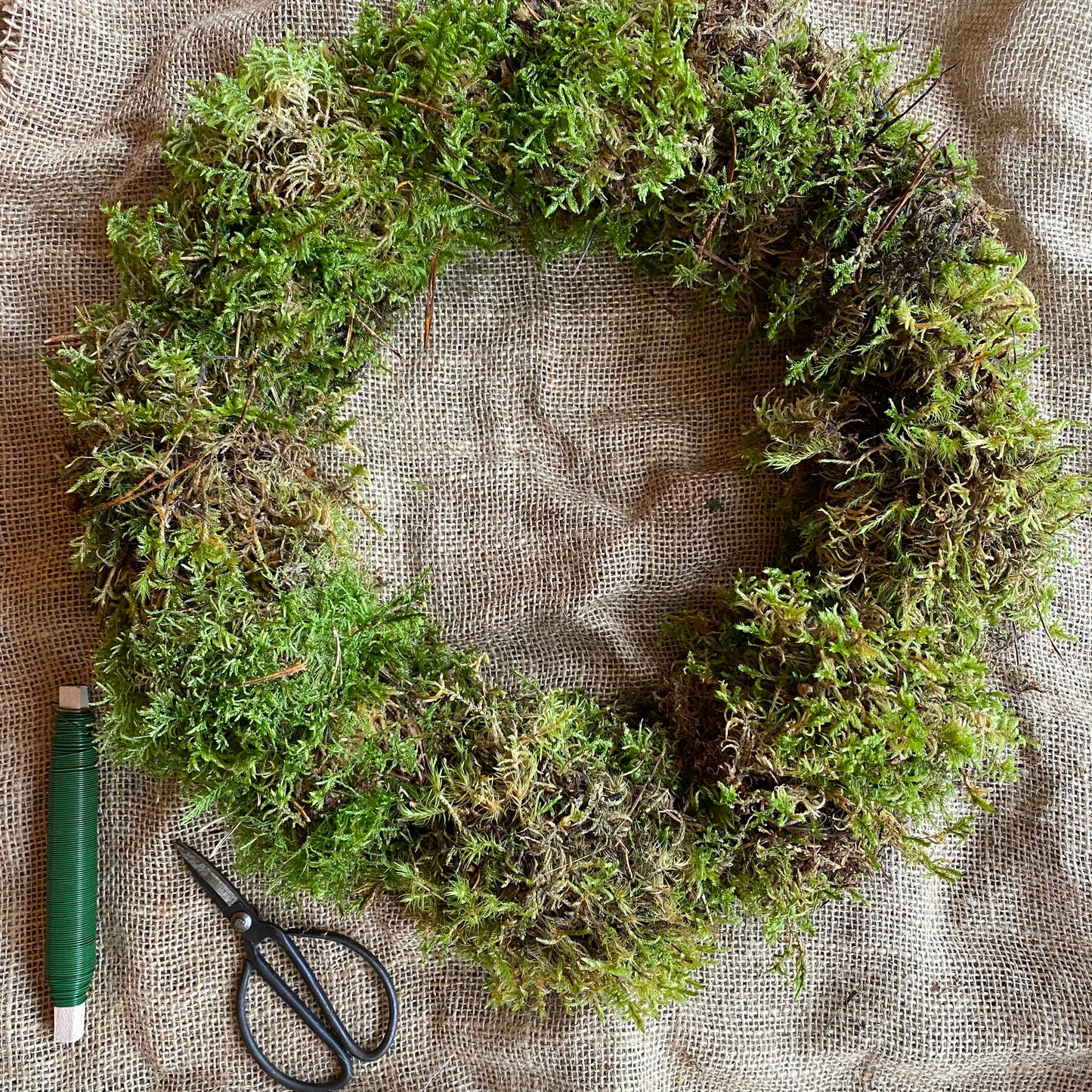 Hessian wrapped moss bundle, wire and rings